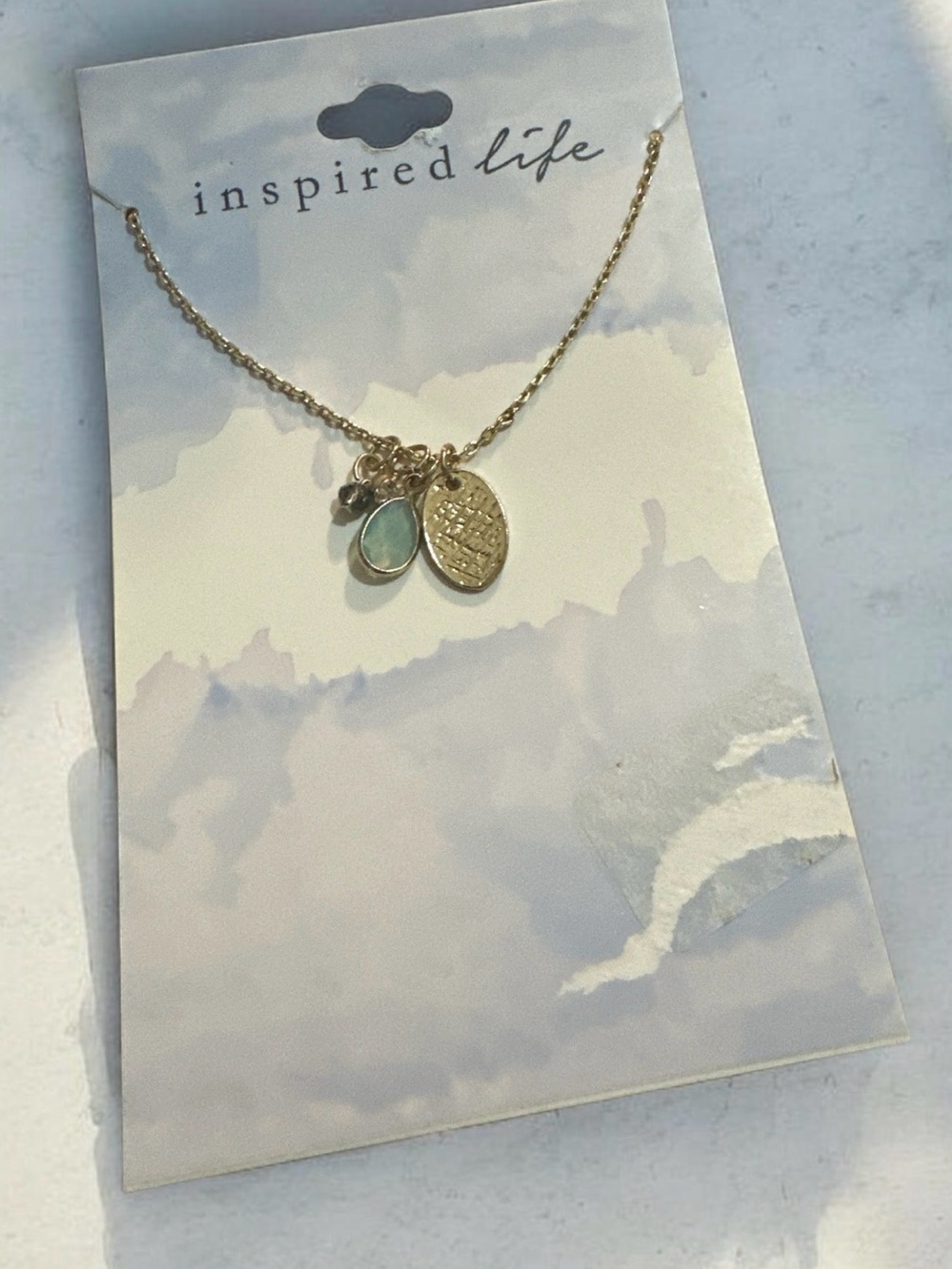 Inspire Gold Necklace with Aqua Teardrop Charm
1917